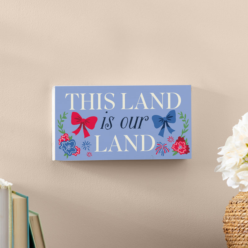 American Classic Red White & Bows Wood Hanging Sign w/ Rope, "This Land Is Our Land", 11"x6"