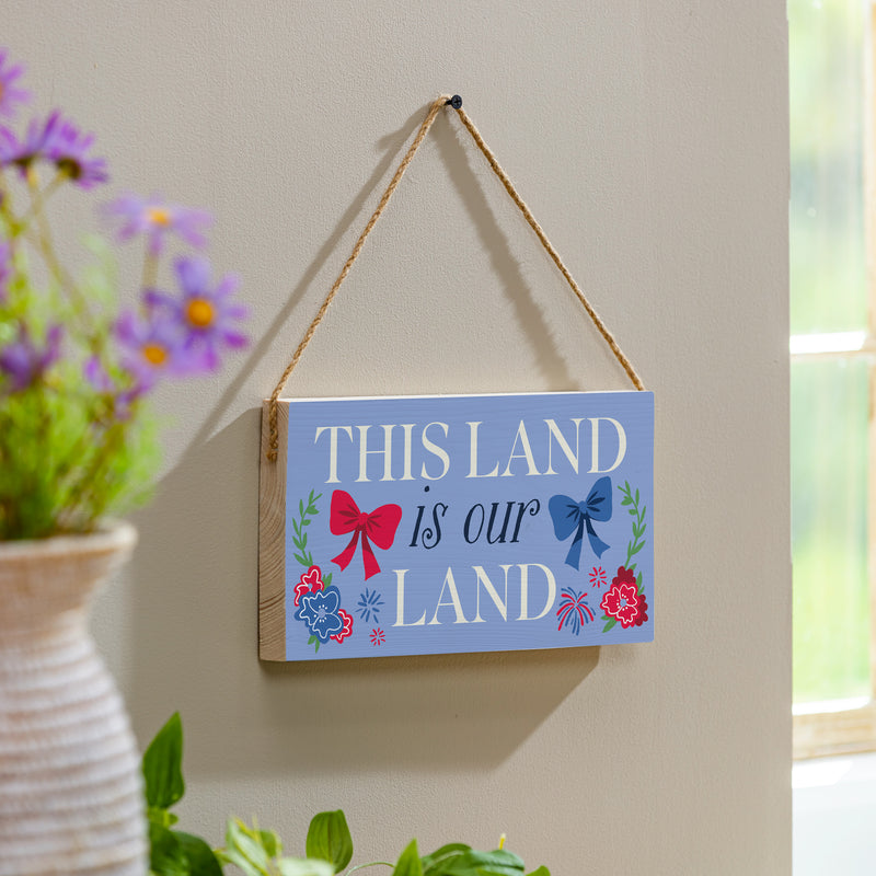American Classic Red White & Bows Wood Hanging Sign w/ Rope, "This Land Is Our Land", 11"x6"